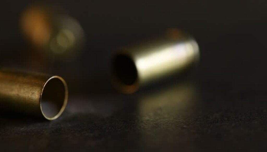 Bullet cartridges on the floor. 4k resolution video footage.