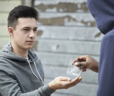 depositphotos_53459093-stock-photo-teenage-boy-buying-drugs-on