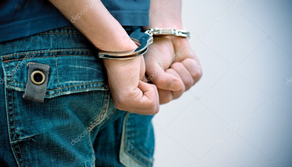 depositphotos_7149143-stock-photo-young-man-in-handcuffs