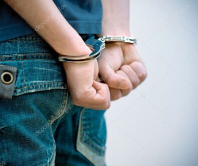 depositphotos_7149143-stock-photo-young-man-in-handcuffs